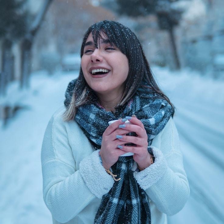 Alexandra Reed, Lead Design Curator at Green Trail Studio, reviewing corporate floral arrangements